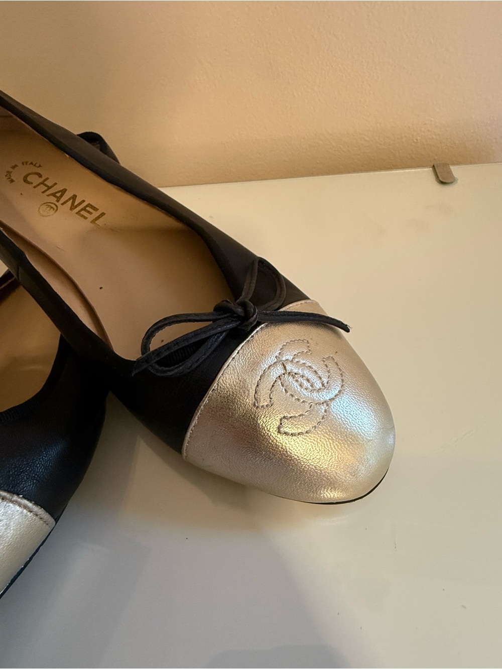 CHANEL Black and Gold Cap-Toe Leather Ballet Flats
